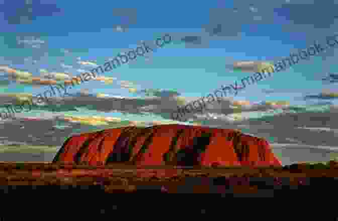 Uluru, A Large Red Rock Formation In The Australian Outback Escapes Vic DiMartino